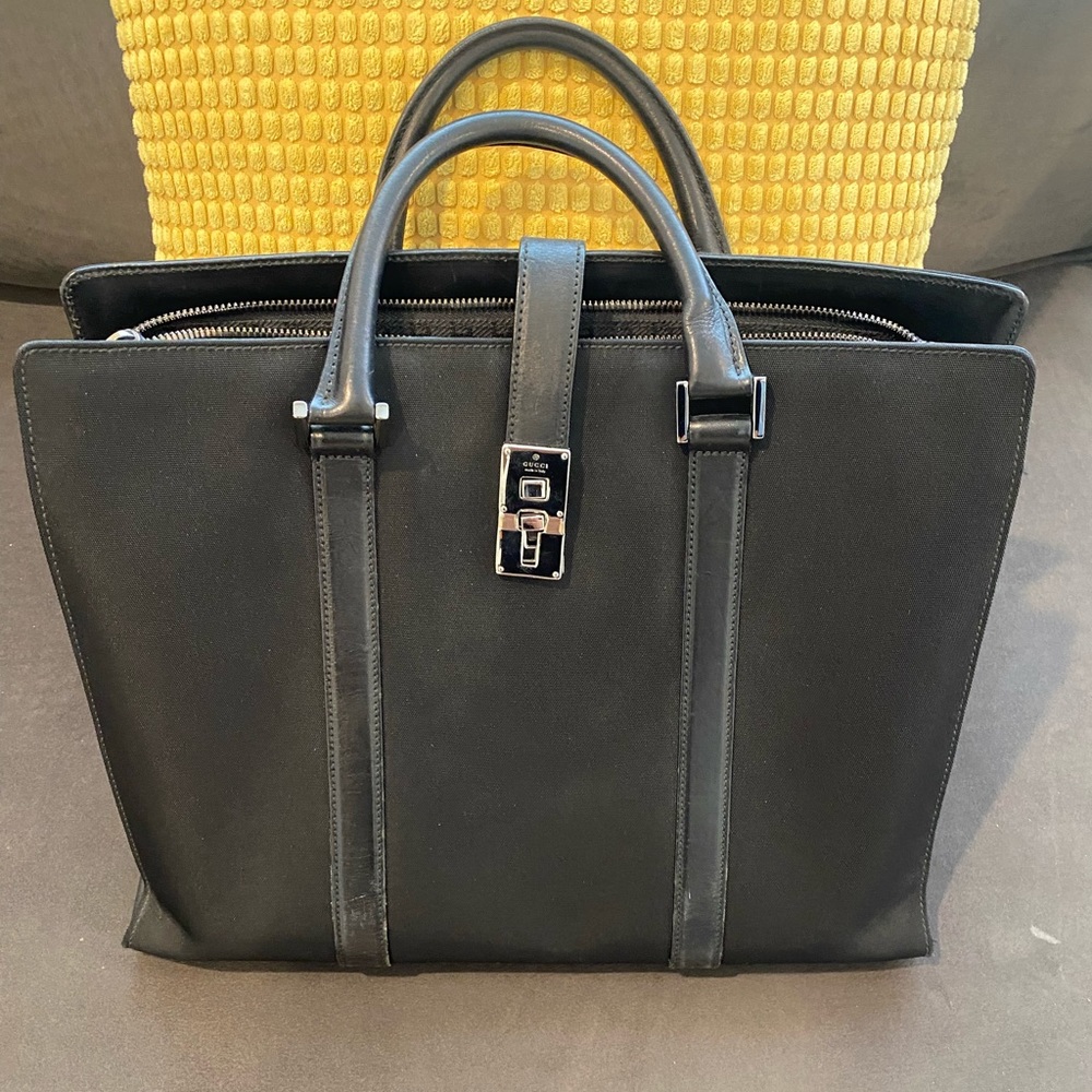 GUCCI black canvas & leather trim & a key lock briefcase tote.